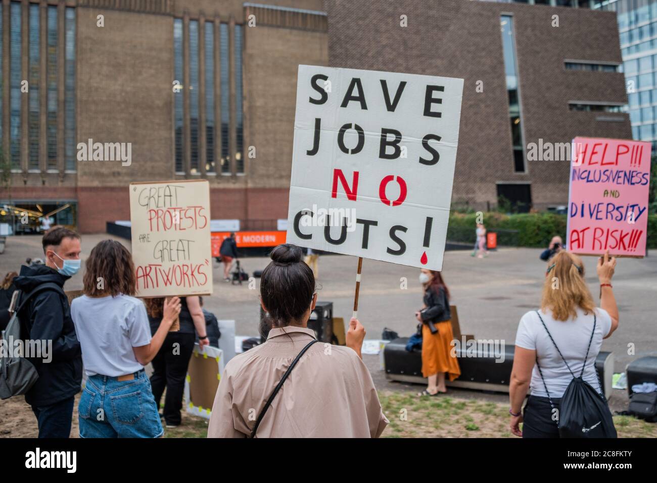 London, UK. 24th July, 2020. Protestors outside because the Tate has axed 300 jobs in the enterprises side of the business - The Tate Modern re-opens on Monday. Visitors are asked to follow guidance on social distancing etc, in line with advice from government following the easing of the lockdown. Credit: Guy Bell/Alamy Live News Stock Photo