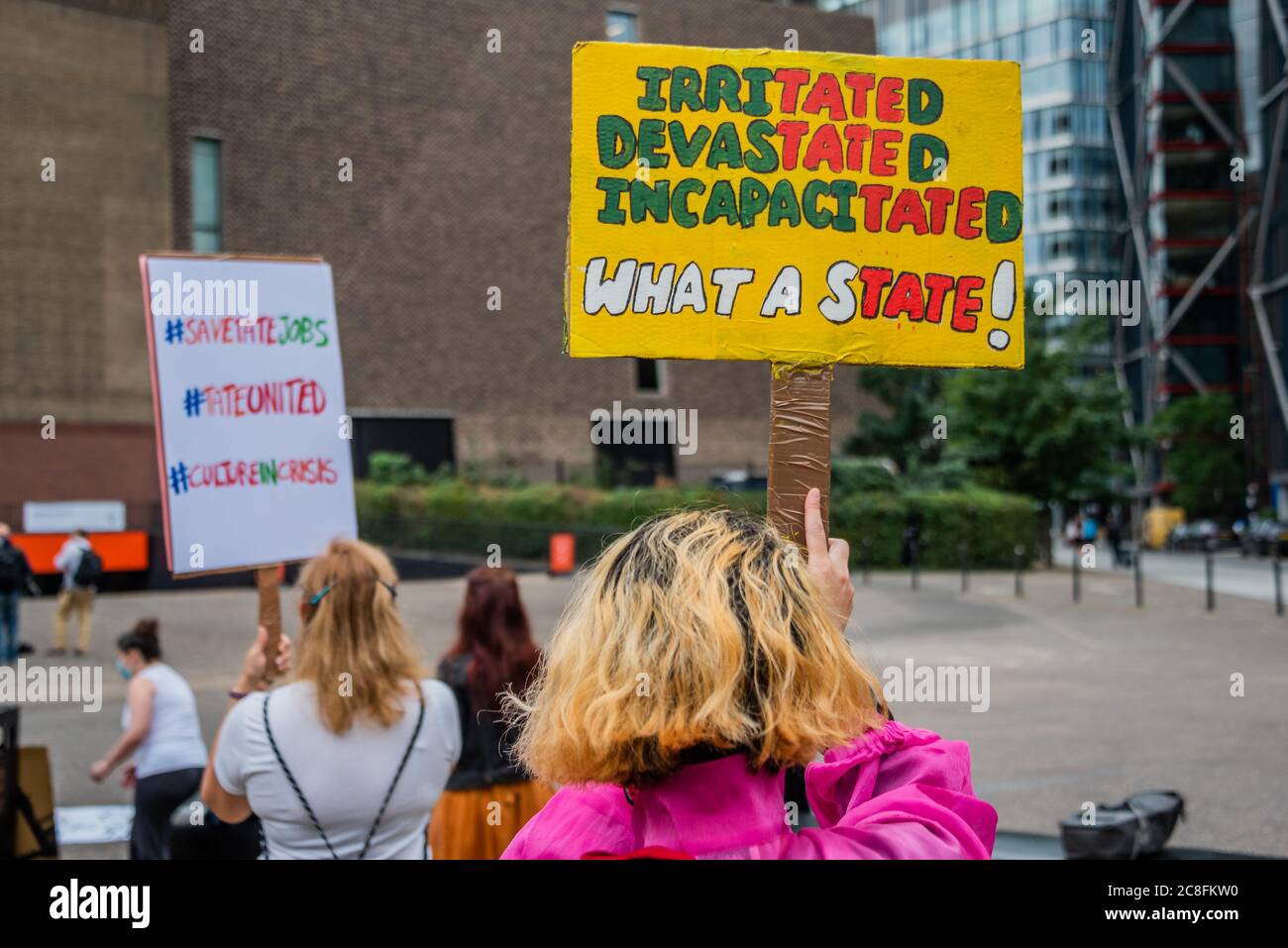 London, UK. 24th July, 2020. Protestors outside because the Tate has axed 300 jobs in the enterprises side of the business - The Tate Modern re-opens on Monday. Visitors are asked to follow guidance on social distancing etc, in line with advice from government following the easing of the lockdown. Credit: Guy Bell/Alamy Live News Stock Photo