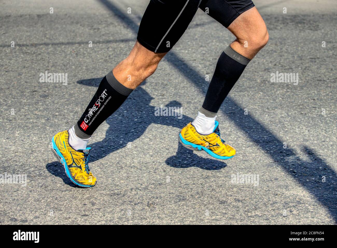 Ekaterinburg, Russia - August 7, 2016: legs man runner in running shoes  Mizuno and compression socks Compressport in Europe-Asia Marathon Stock  Photo - Alamy