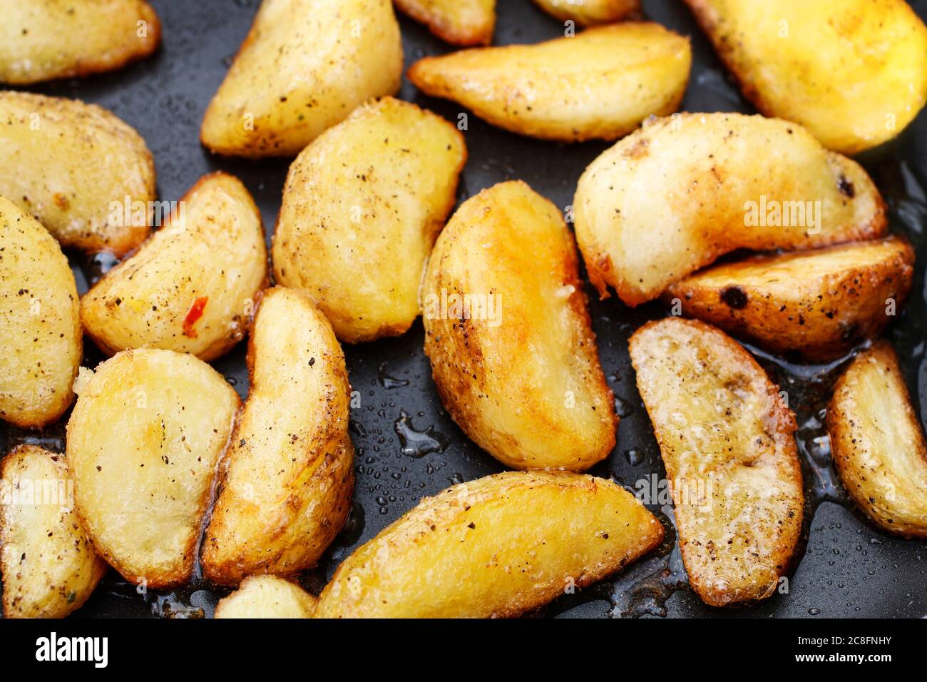 How to make a roasted potatoes with herbs. Step by step, tutorial. Cooking time Stock Photo