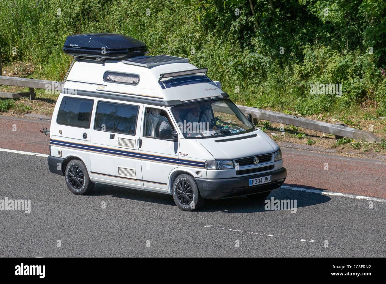 1996 90s white VW Volkswagen 1000 TD SWB; Touring Caravans and Motorhomes, campervans on Britain's roads, RV leisure vehicle, family holidays, caravanette vacations, caravan holiday, van conversions, autohome, life on the road, Stock Photo