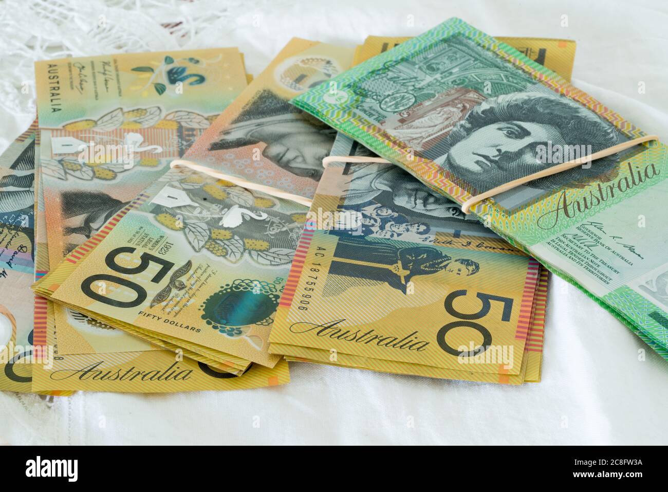 Piles of Australian currency fifty and one hundred dollar notes Stock Photo