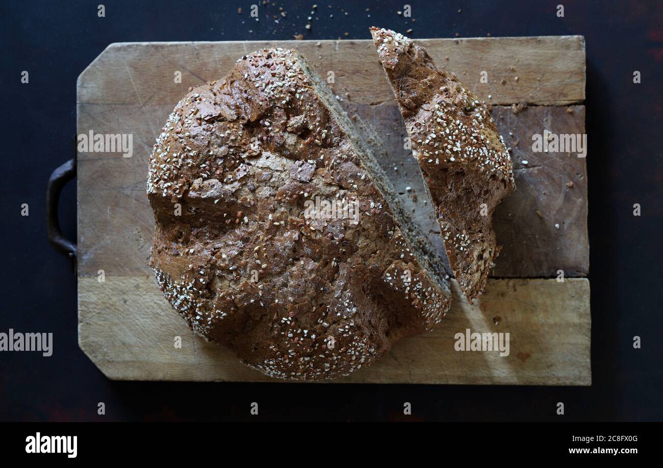 Cereal bread, view from above on dark background Stock Photo - Alamy