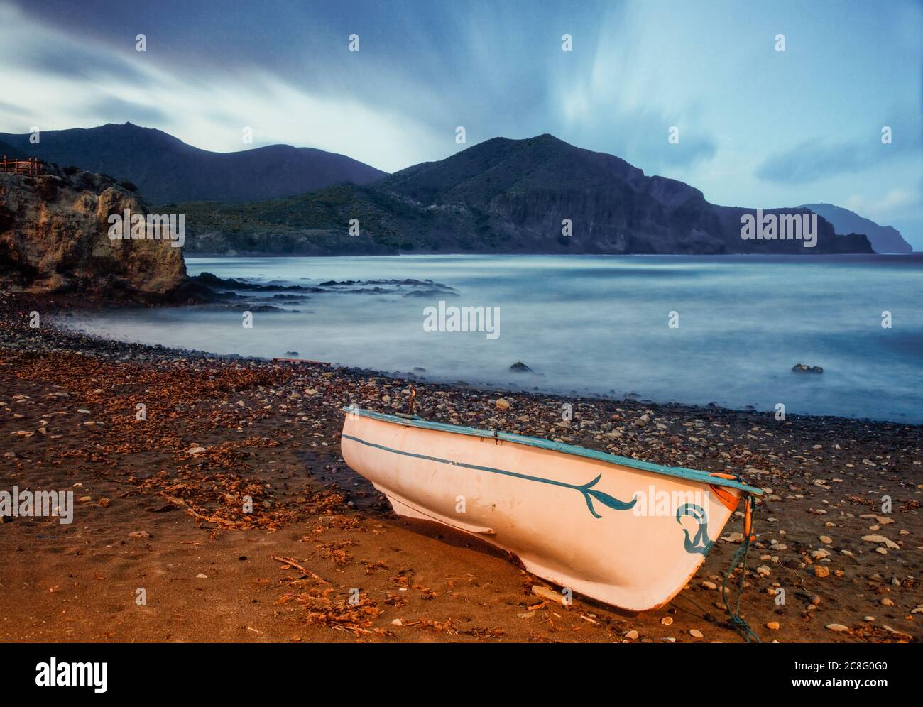 geography / travel, Spain, A boat sits safely moored on a beach along the Cabo de Gata Natural Park as a storm blows over , No-Tourism-Advertising-Use Stock Photo