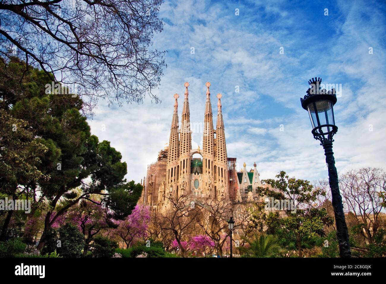 geography/travel, Spain, A beautiful park partially frames La Sagrada  Familia, Guidi's most well known design in Barcelona,  No-Tourism-Advertising-Use Stock Photo - Alamy