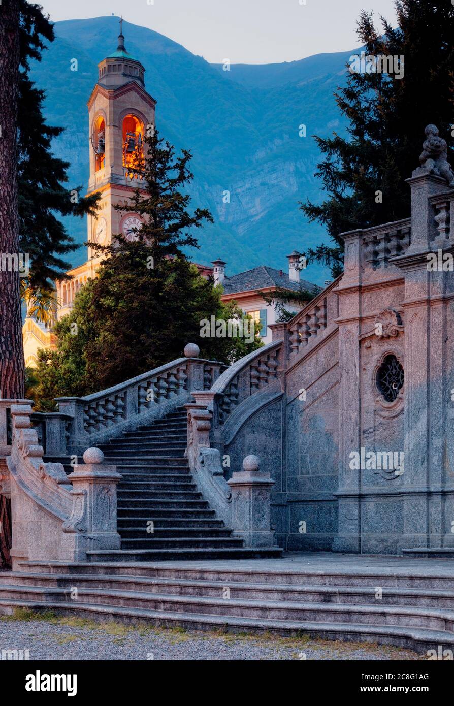 geography / travel, Italy, Orange light glows from the top of a church bell tower along the shores of Lake Como in Lombard, No-Tourism-Advertising-Use Stock Photo