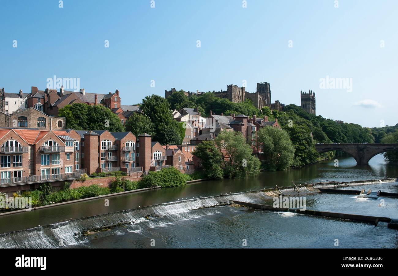 River Wear and houses in the cathedral city of Durham with Durham Cathedral and castle behind, County Durham, England. Stock Photo