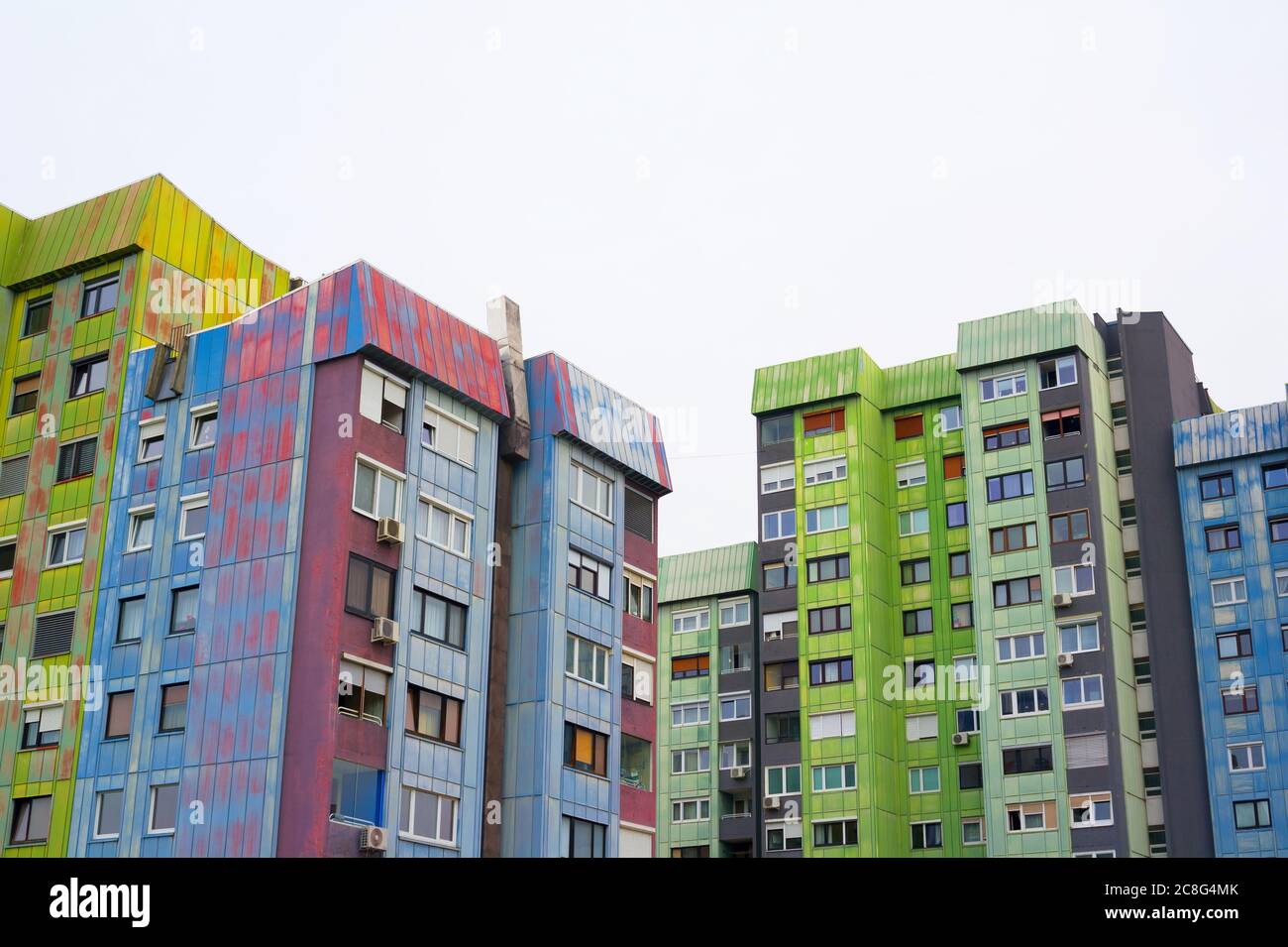 Colorful block of flats in Slovenian city - old and ugly architecture and residential building. Housing project was made in style of brutalism in era Stock Photo