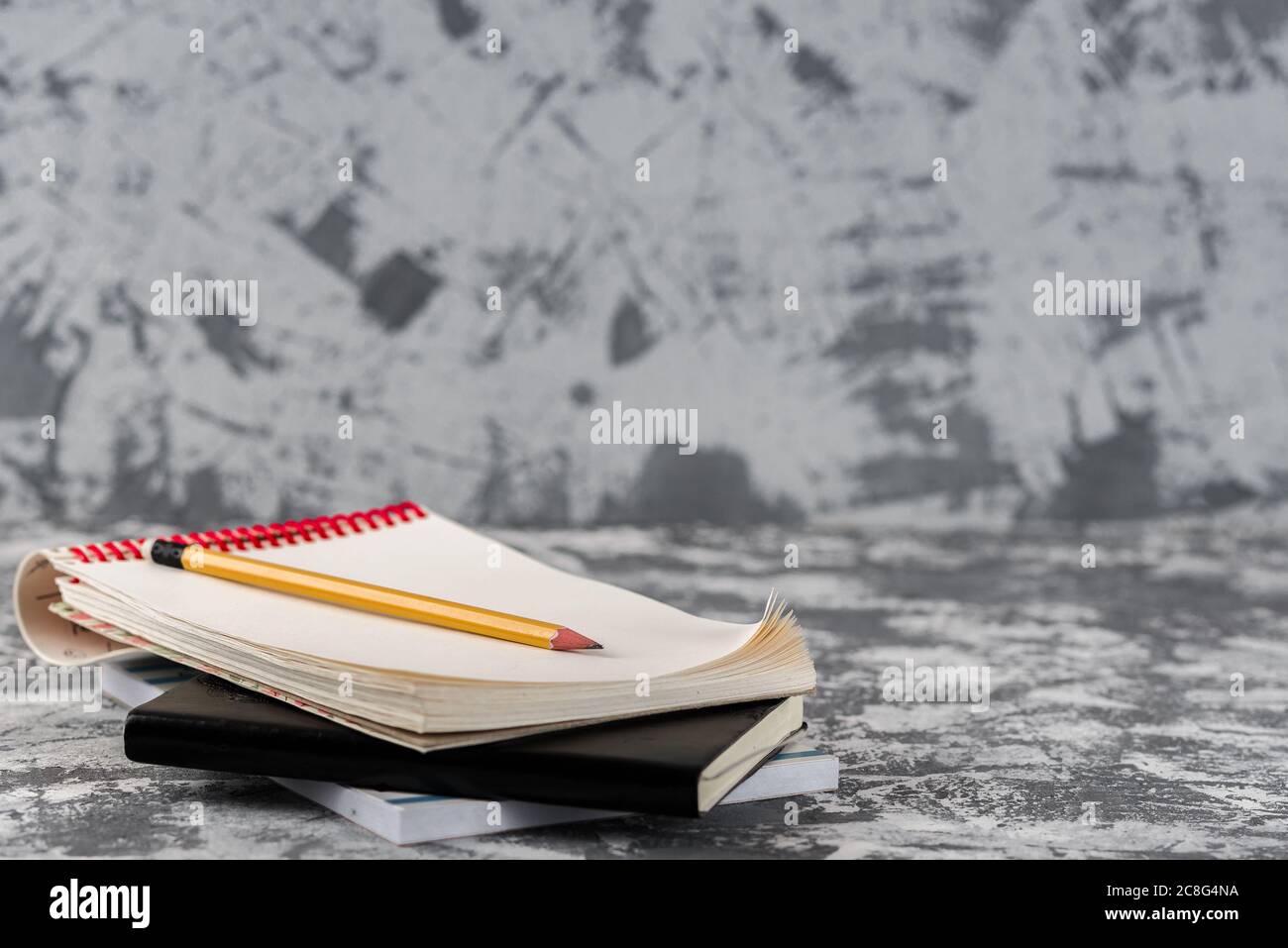 Sketchbook Notepad With Wood Pencil on stone Table Desk Background