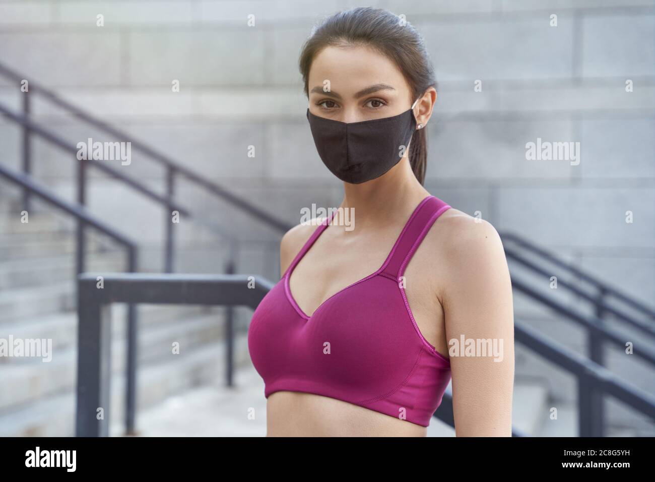 Young Fitness Sport Woman Running And She Wears A Mask For