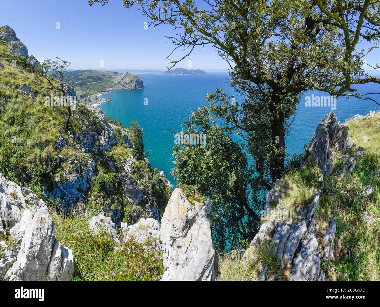 meadow next to the cliff of Monte Candina with Liendo beach in the background Stock Photo