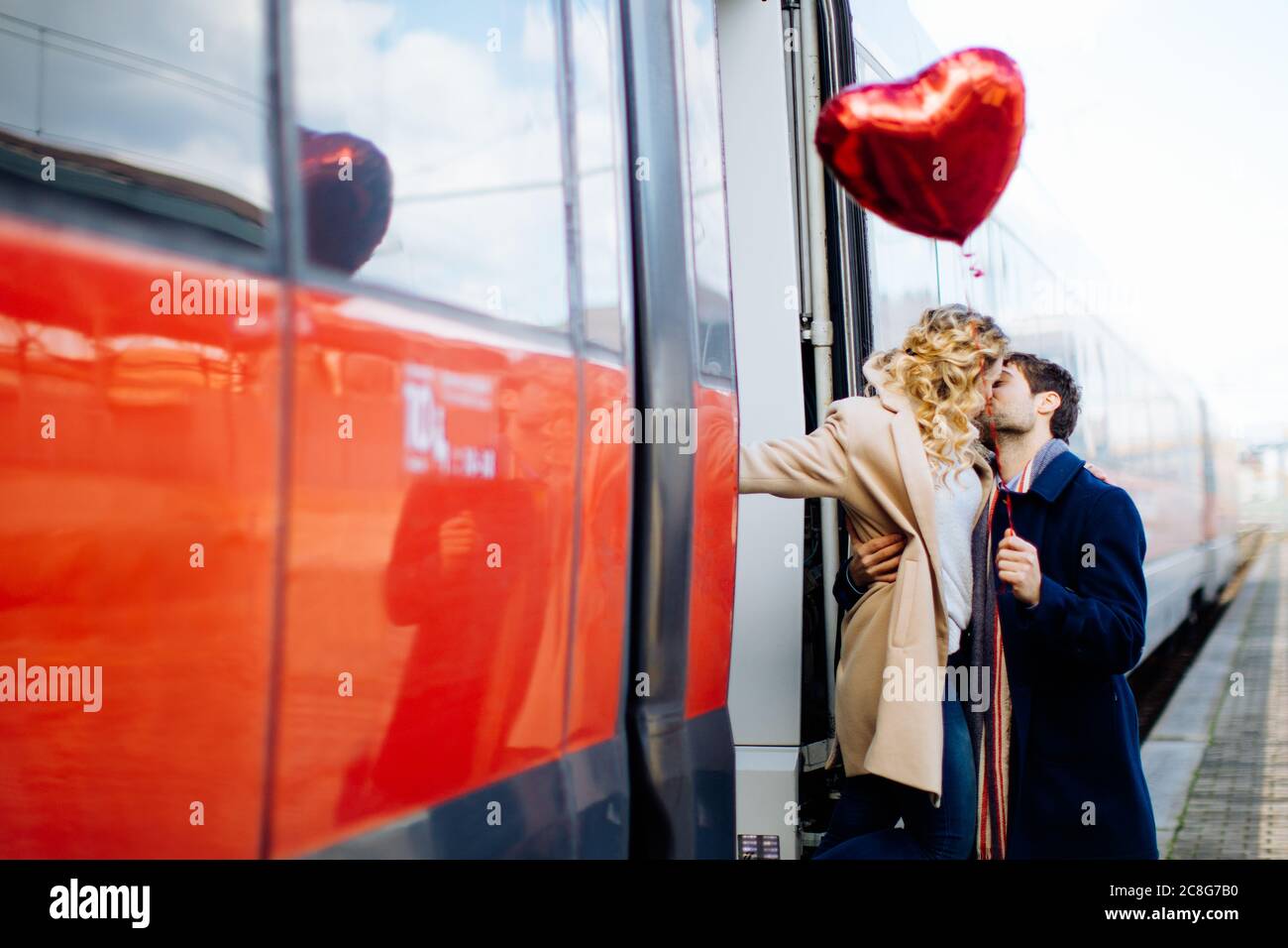 Couple kissing beside train, Firenze, Toscana, Italy Stock Photo