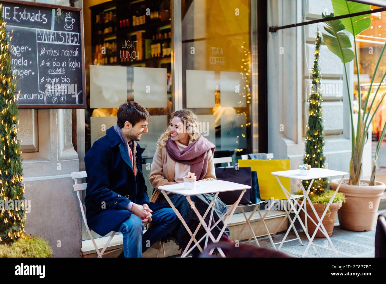 Couple talking at cafe, Firenze, Toscana, Italy Stock Photo