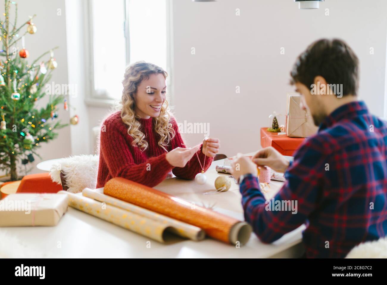 Couple preparing Christmas decorations at home Stock Photo
