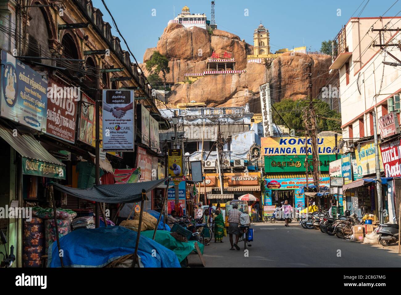 Trichy, Tamil Nadu, India - February 2020: The market street leading to the ancient hill top Rock Fort temple in the city of Tiruchirappalli. Stock Photo