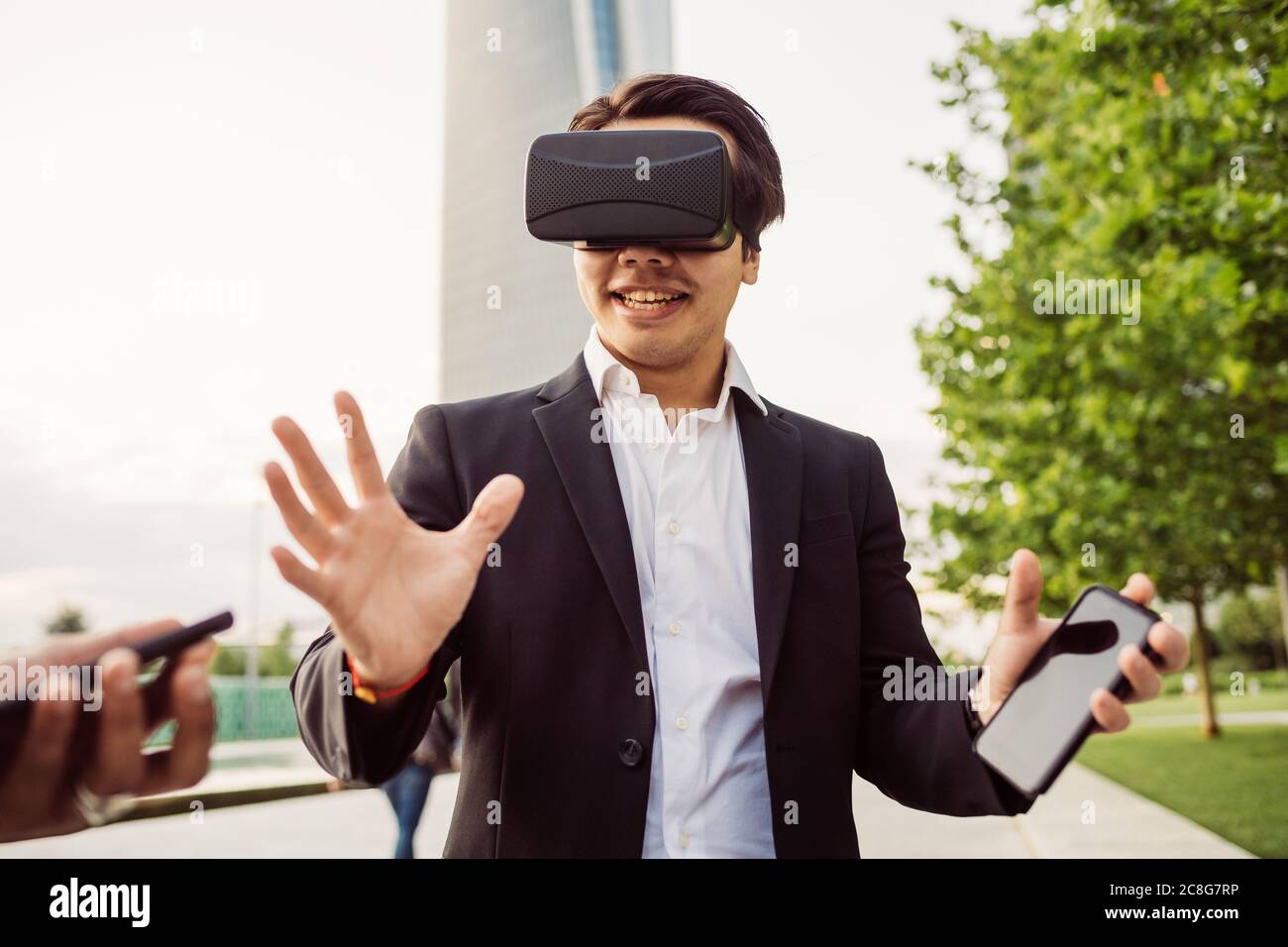 Asian male wearing vr headset hi-res stock photography and images - Alamy