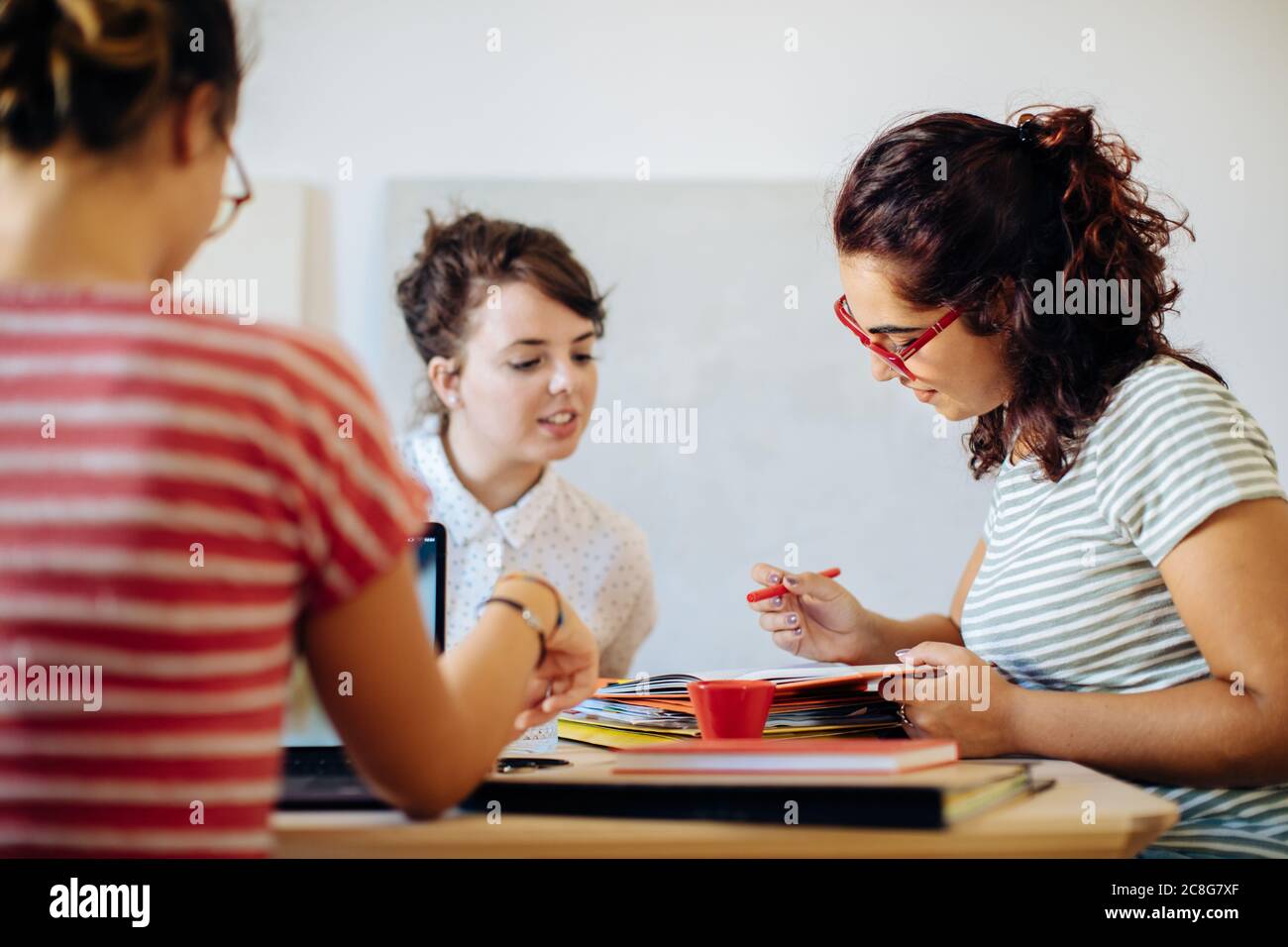 Colleagues discussing documents Stock Photo