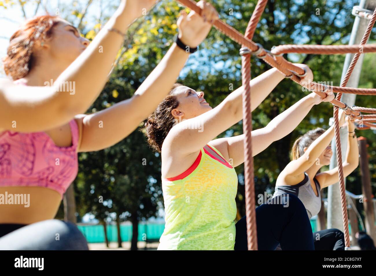 Friends Rope Pull Climbing frame and looking up hi-res stock photography and images - Alamy