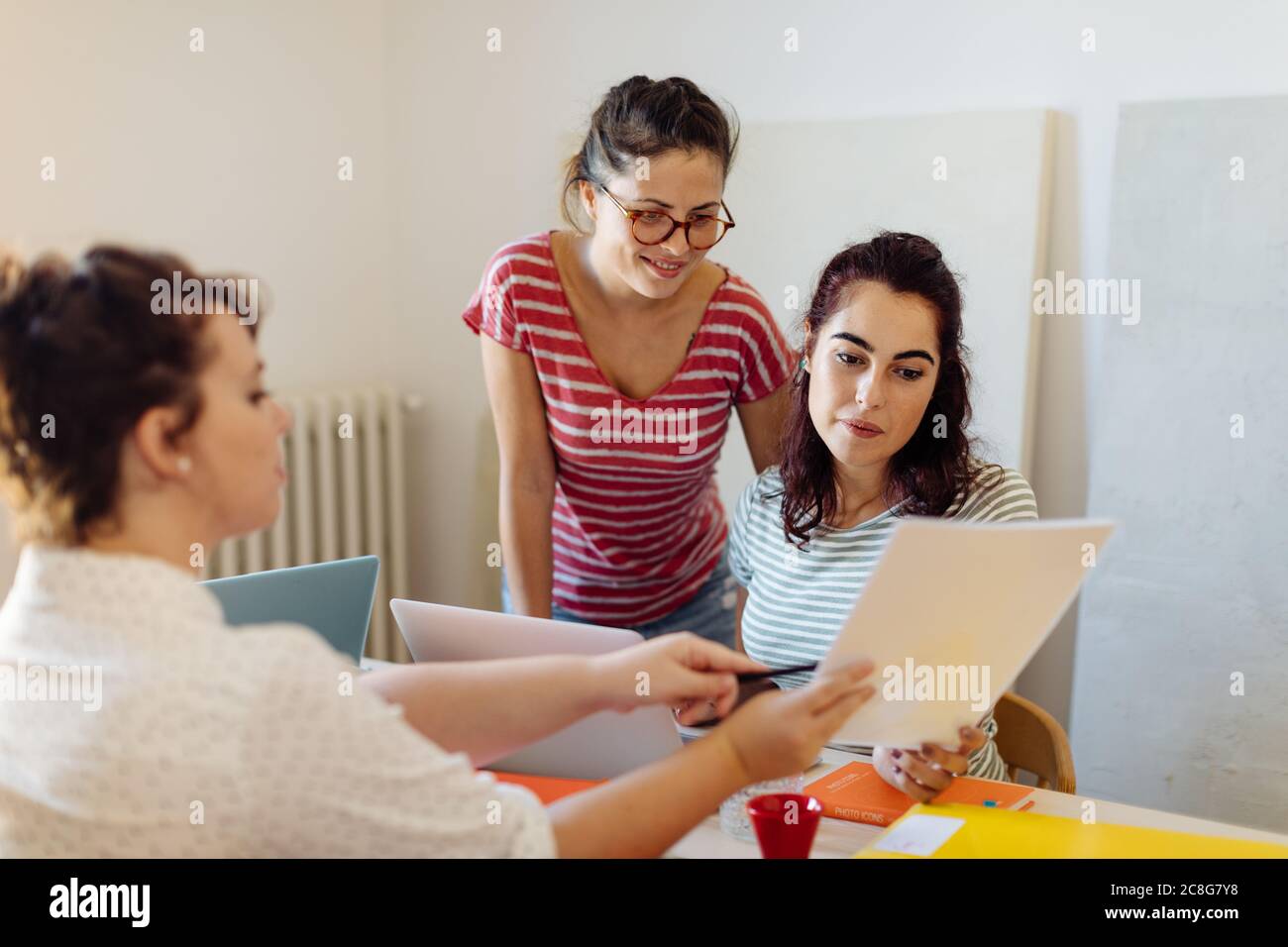 Colleagues discussing documents Stock Photo