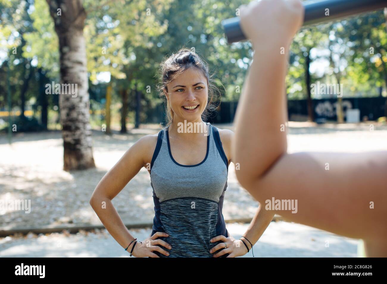 Friends exercising in park Stock Photo