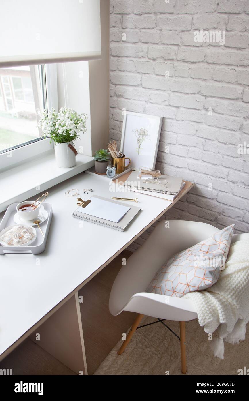 Work table near the window in the Scandinavian Nordic style