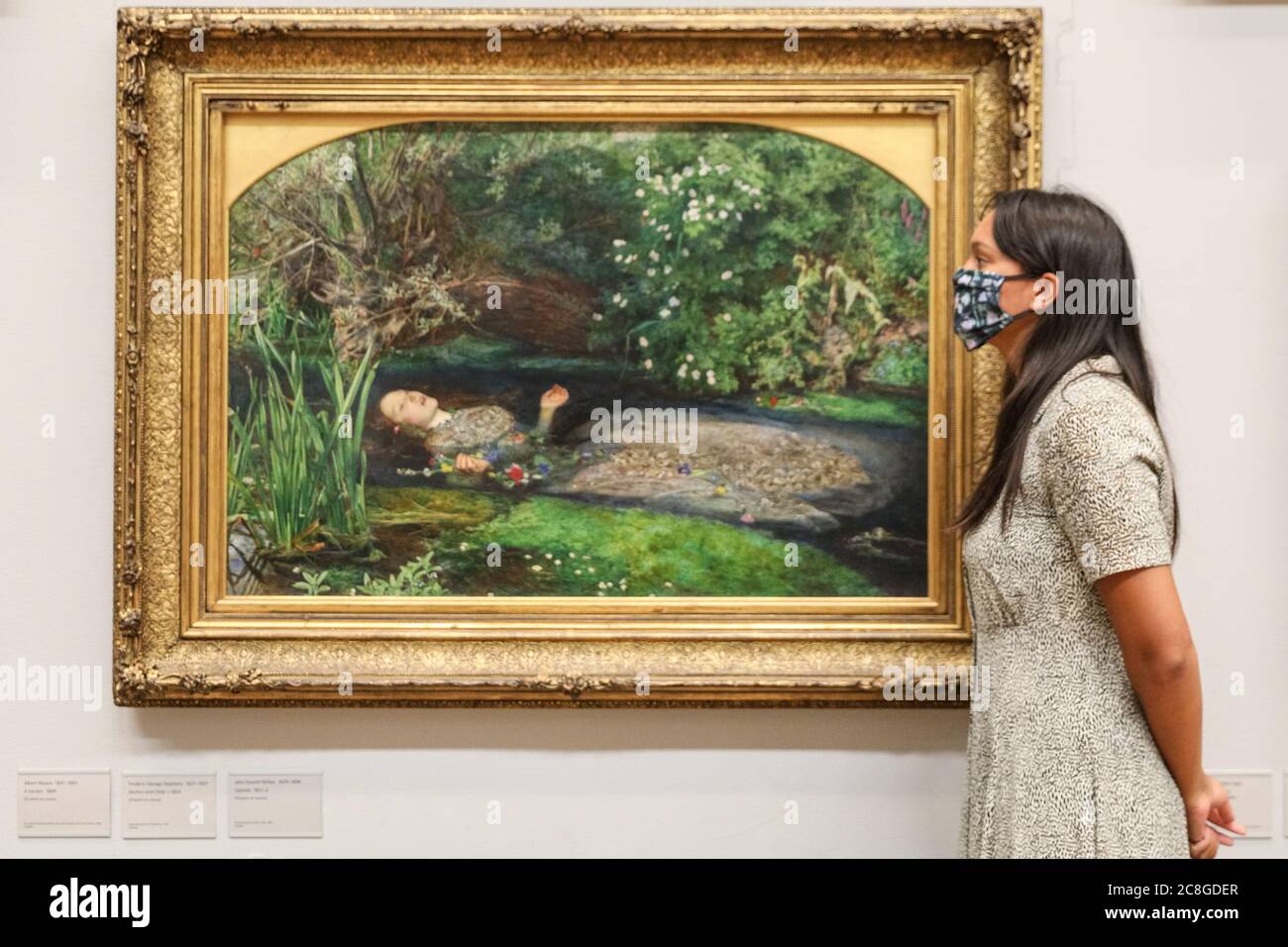 London, UK. 24th July, 2020. An assistant looks at John Everett Millais' famous 'Ophelia'. Tate Britain, along with other Tate Galleries in the country will re-open to visitors Monday, 27th July with social distancing measures in place. Credit: Imageplotter/Alamy Live News Stock Photo