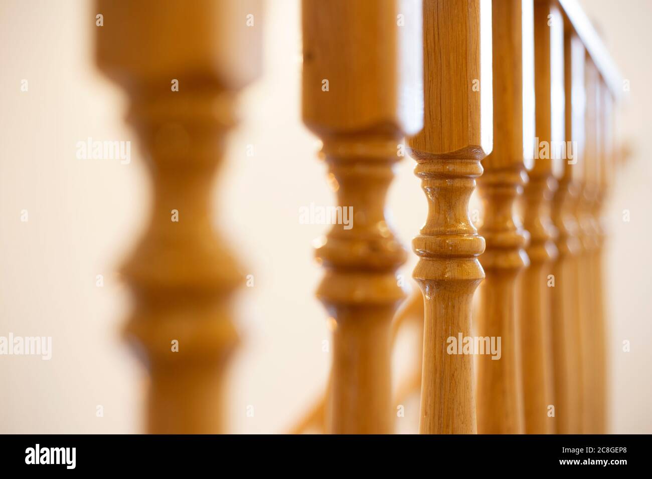 Wooden Railing of an luxury antique staircase, woodwork elements macro photograpy, retro design beautiful interior of a modern house Stock Photo
