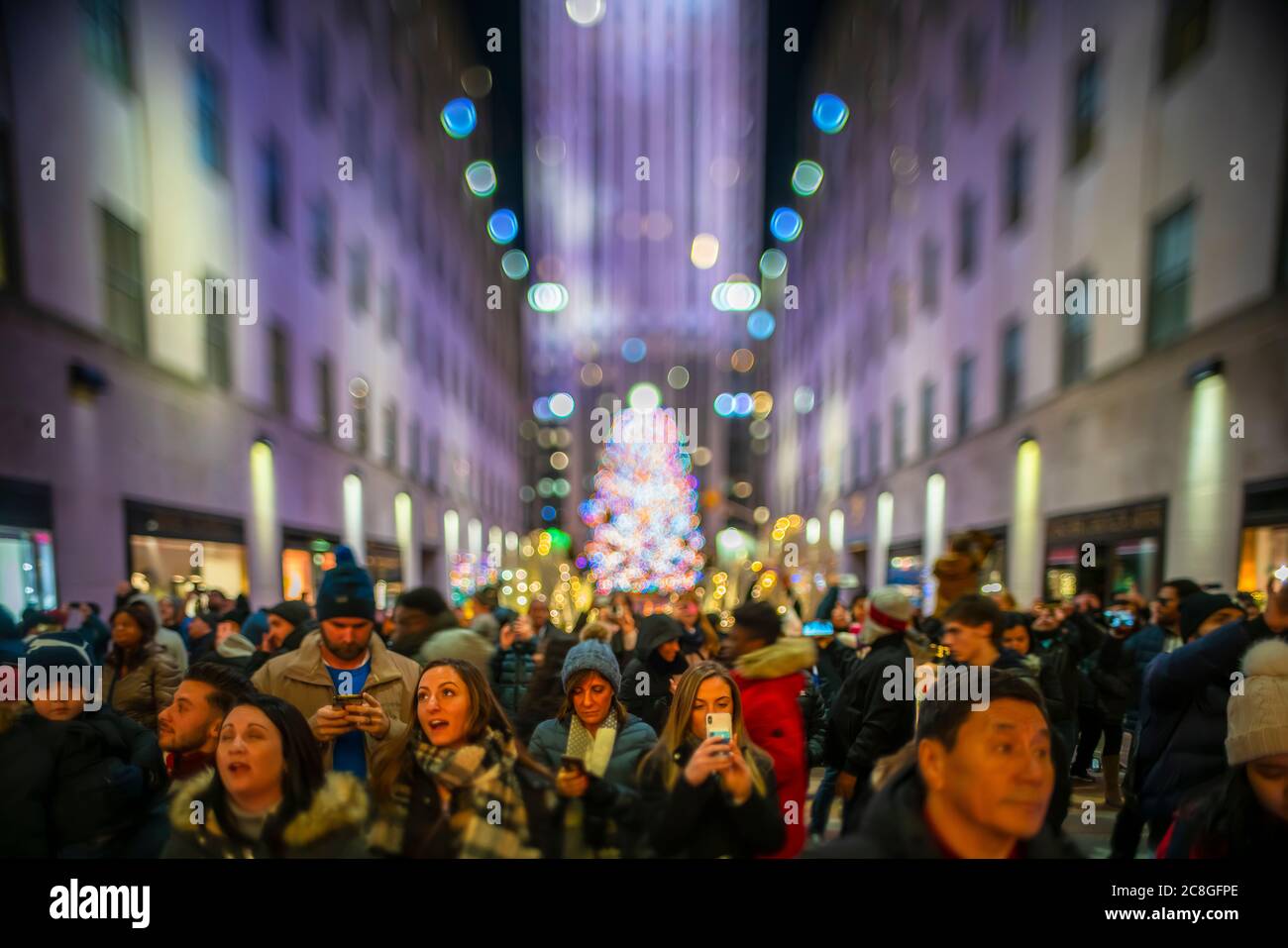 Crowd of people watch the SAKS Fifth Avenue Christmas Light Show Stock