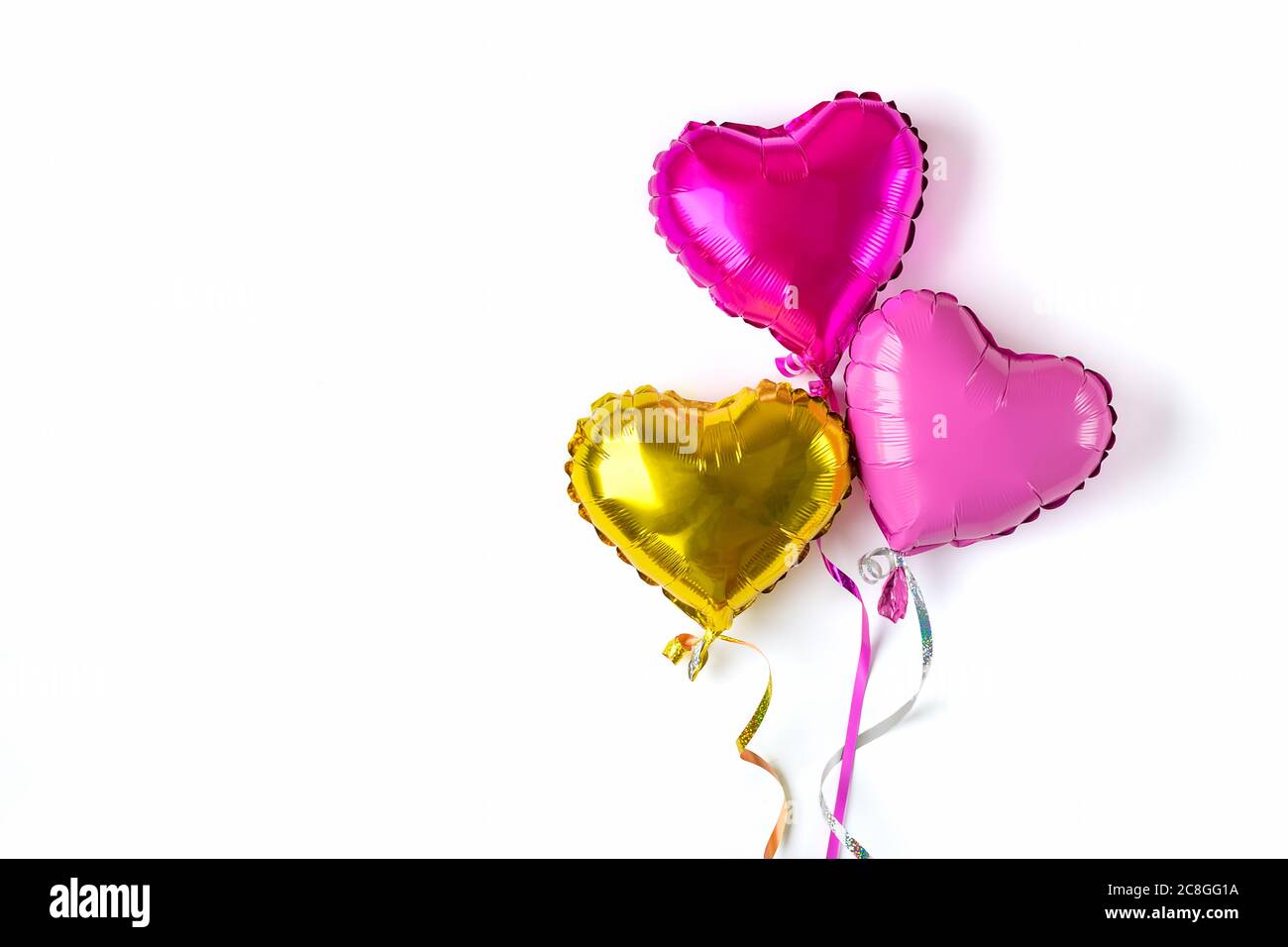 set of three inflatable heart in golden, purple, matte pink color isolated  on white background Flat lay Top view Holiday card Happy Valentine's day  Stock Photo - Alamy