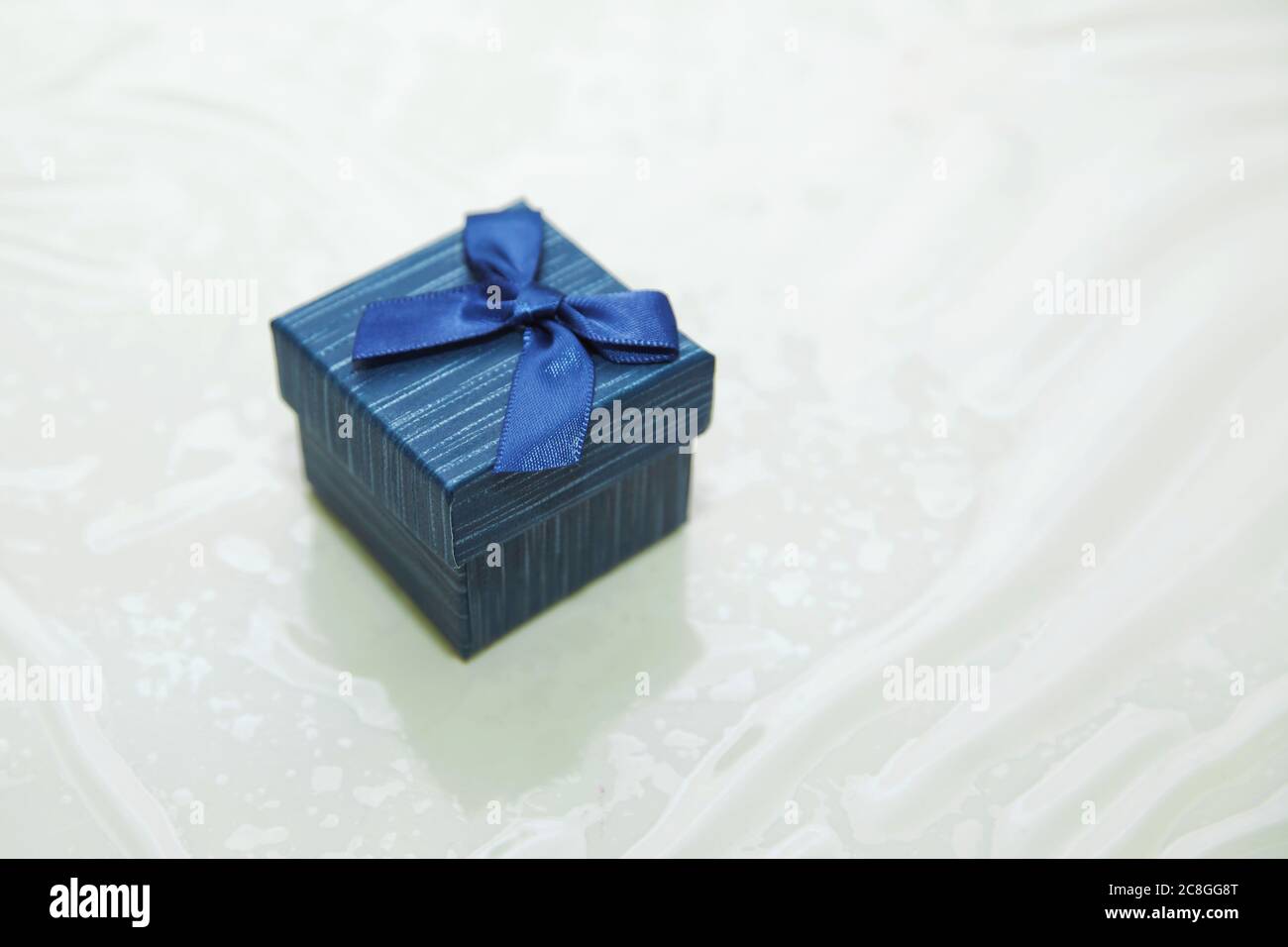 Rectangular ring box . blue jewelry gift box . Marriage proposal concept . Blue ring box . Stock Photo