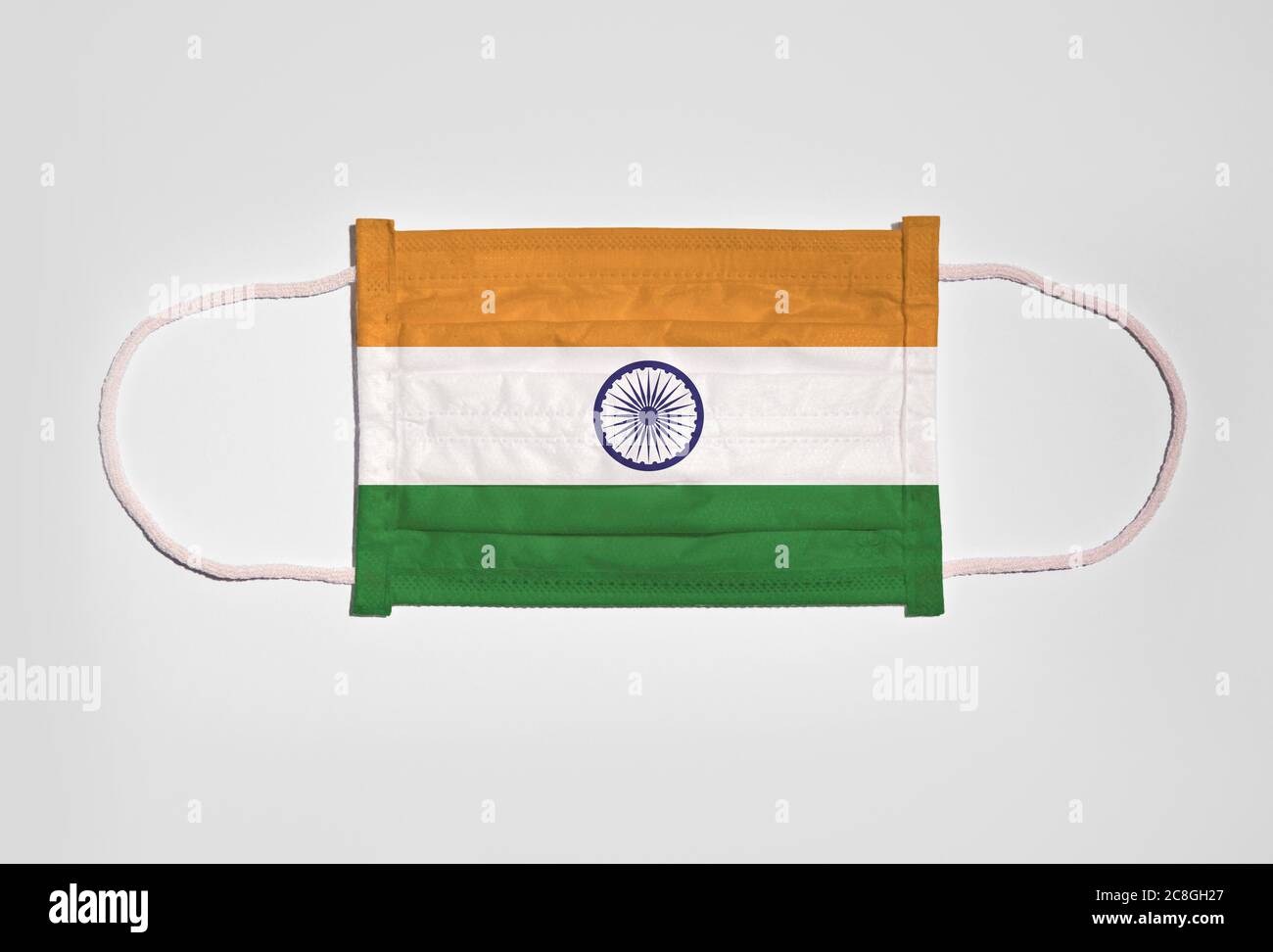Symbol picture Corona crisis, mouth guard, breathing mask, mouth and nose guard with flag of India, white background Stock Photo