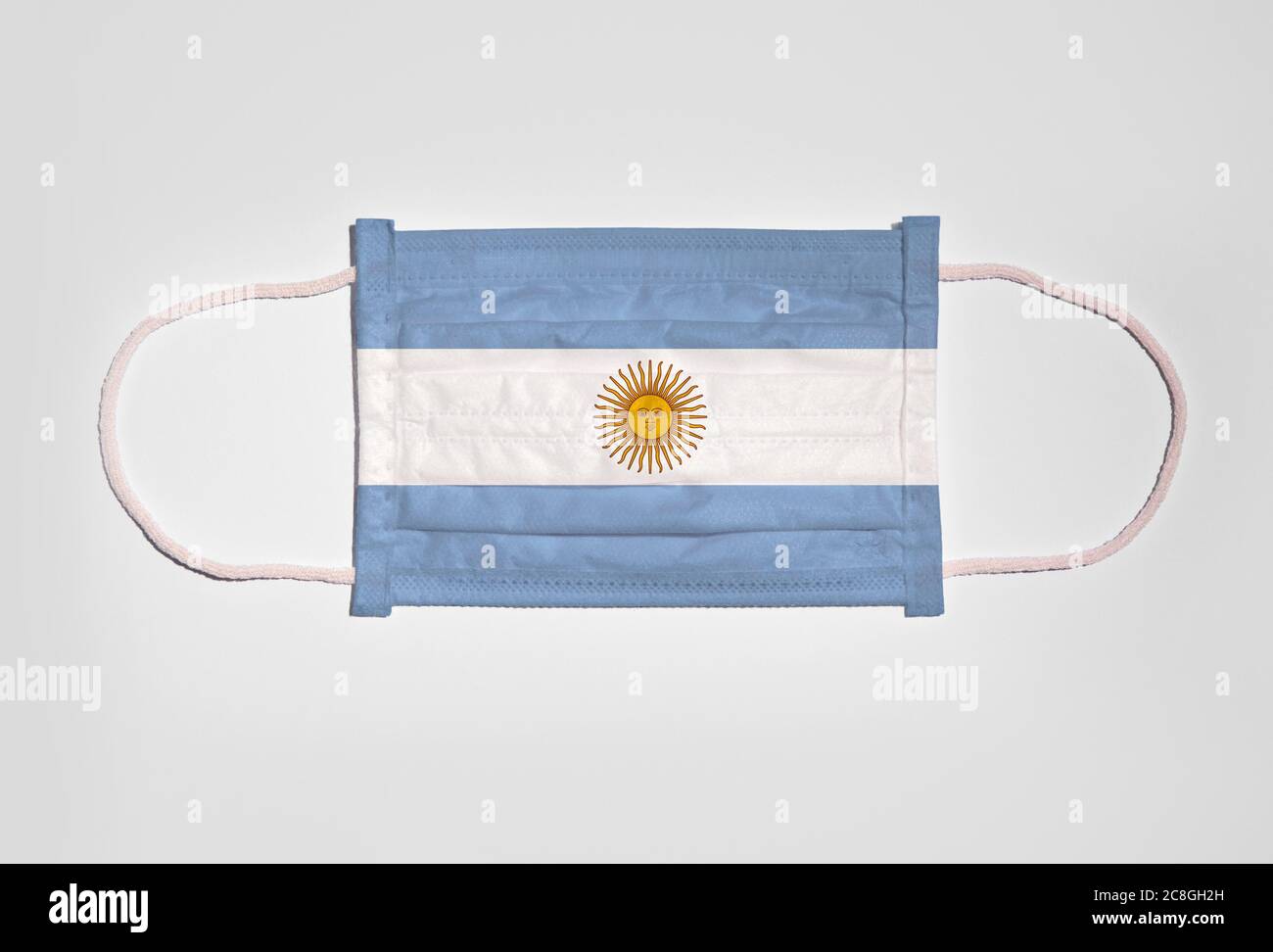 Symbol picture Corona crisis, mouth guard, breathing mask, mouth and nose guard with flag of Argentina, white background Stock Photo