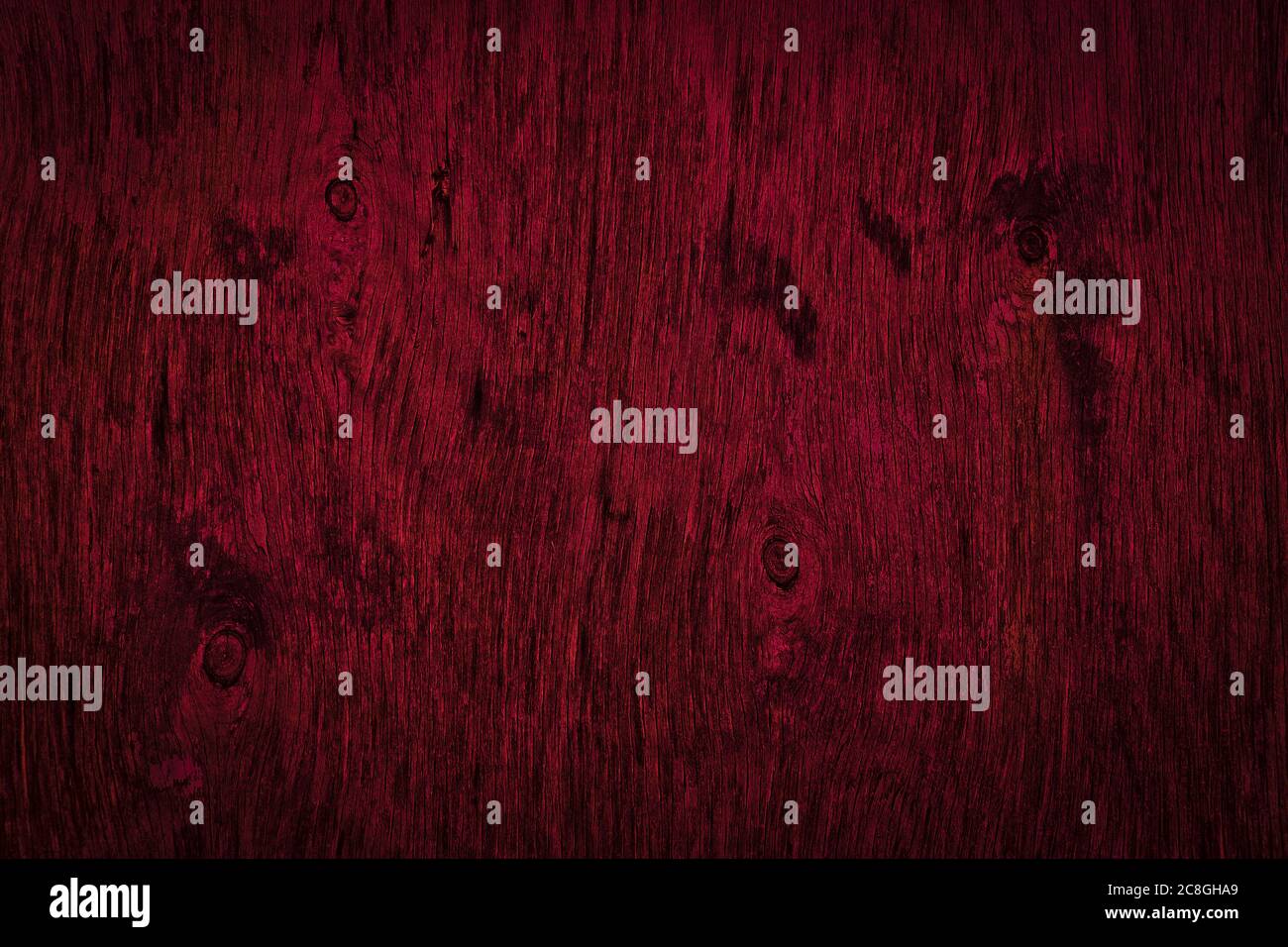 Dark burgundy wood texture. Texture of old dried plywood. Mahogany
