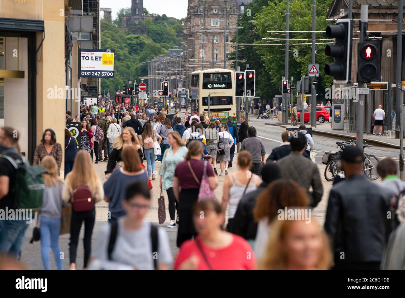 Edinburgh, Scotland, UK. 24 July, 2020. View along busy Princes Street with large numbers of people out shopping during sales. Iain Masterton/Alamy Live News Stock Photo