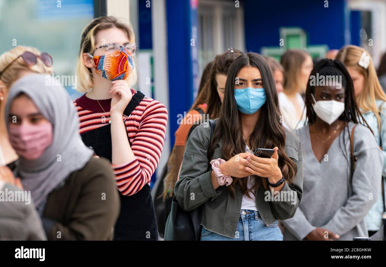 Edinburgh, Scotland, UK. 24 July, 2020. Social distancing in queue by customers wearing facemasks outside Zara on Princes Street in Edinburgh. Iain Masterton/Alamy Live News Stock Photo