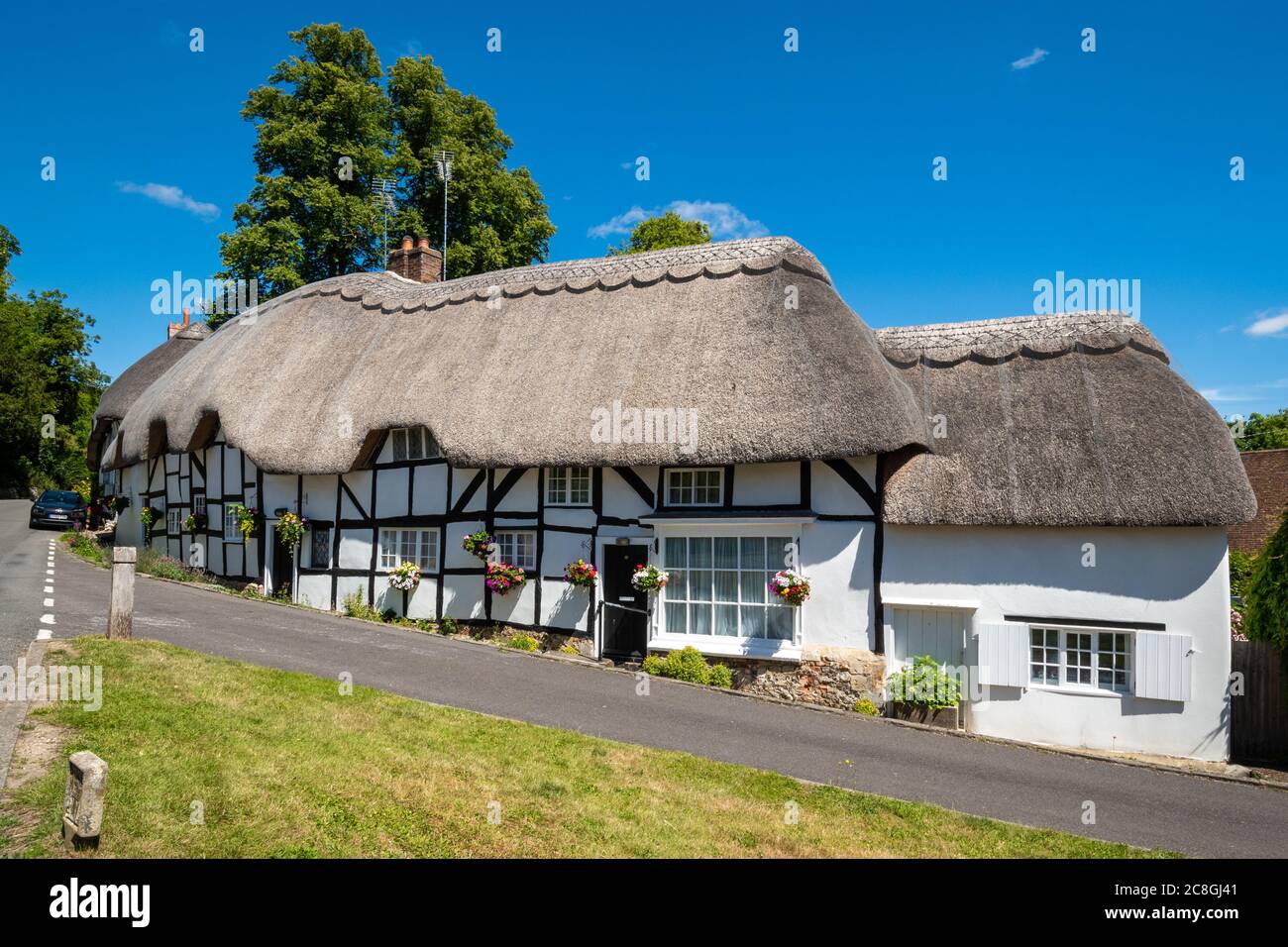 Pretty thatched cottages in the Hampshire village of Wherwell, England, UK, during summer Stock Photo