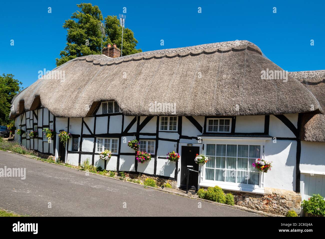 Pretty thatched cottages in the Hampshire village of Wherwell, England, UK, during summer Stock Photo