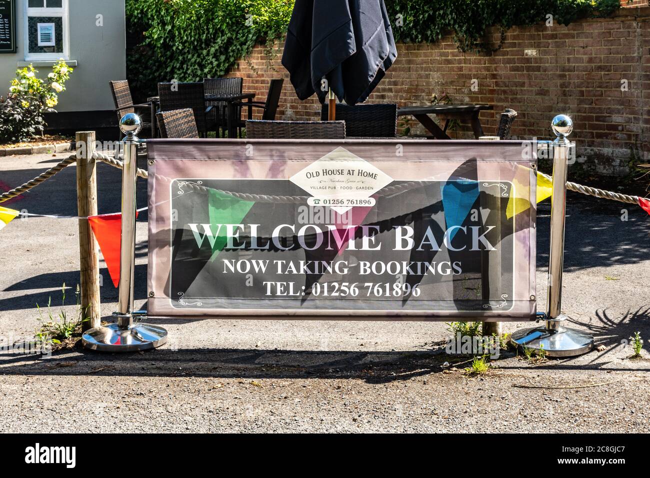 Pub sign with the message Welcome Back in July 2020 following easing of the coronavirus covid-19 lockdown restrictions Stock Photo