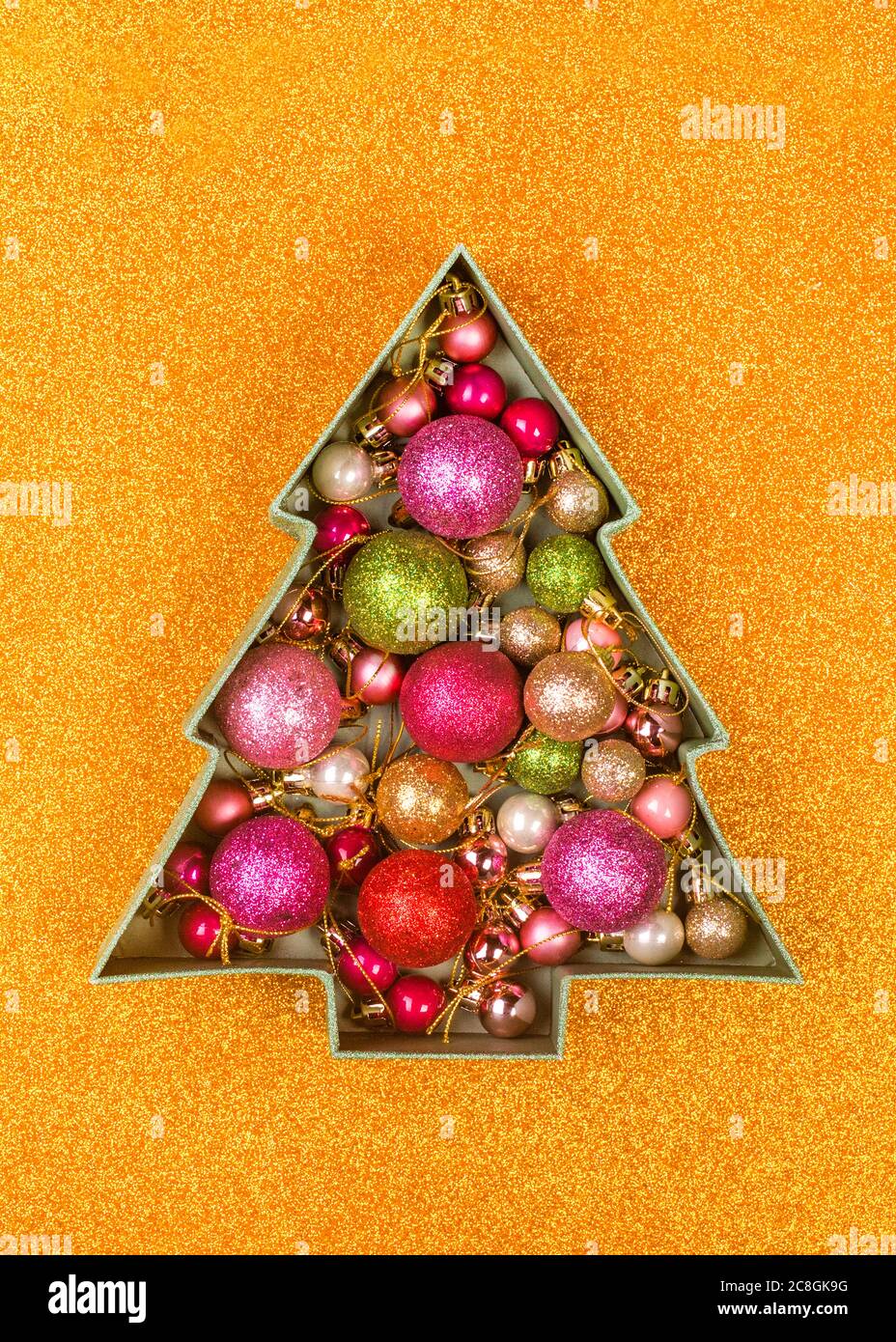 christmas tree shaped box with ornaments Stock Photo Alamy