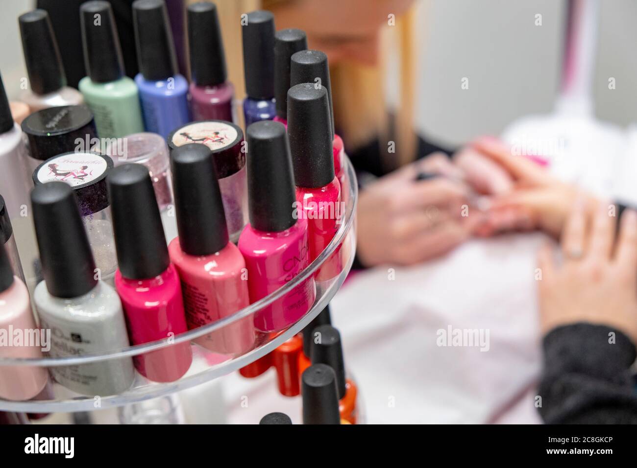 Nails getting painted by beautician Stock Photo