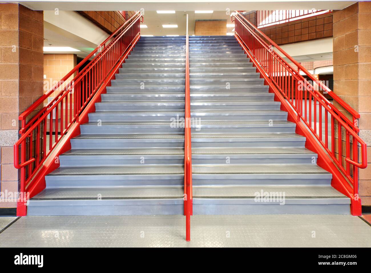 Anti slip floor treads on the steps of an elementary school stairway. Stock Photo