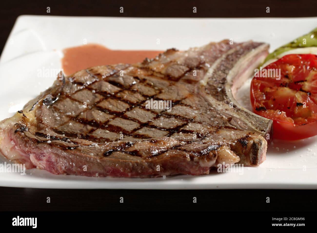 Cowboy beef steak with grilled vegetables close-up. Photos for restaurant and cafe menus Stock Photo