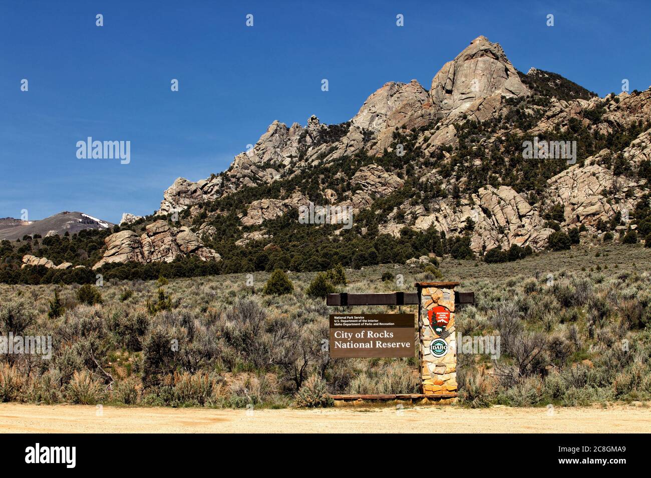 The front entrance sign and granite formations in the City of Rocks National Reserve near Oakley, Idaho. Stock Photo