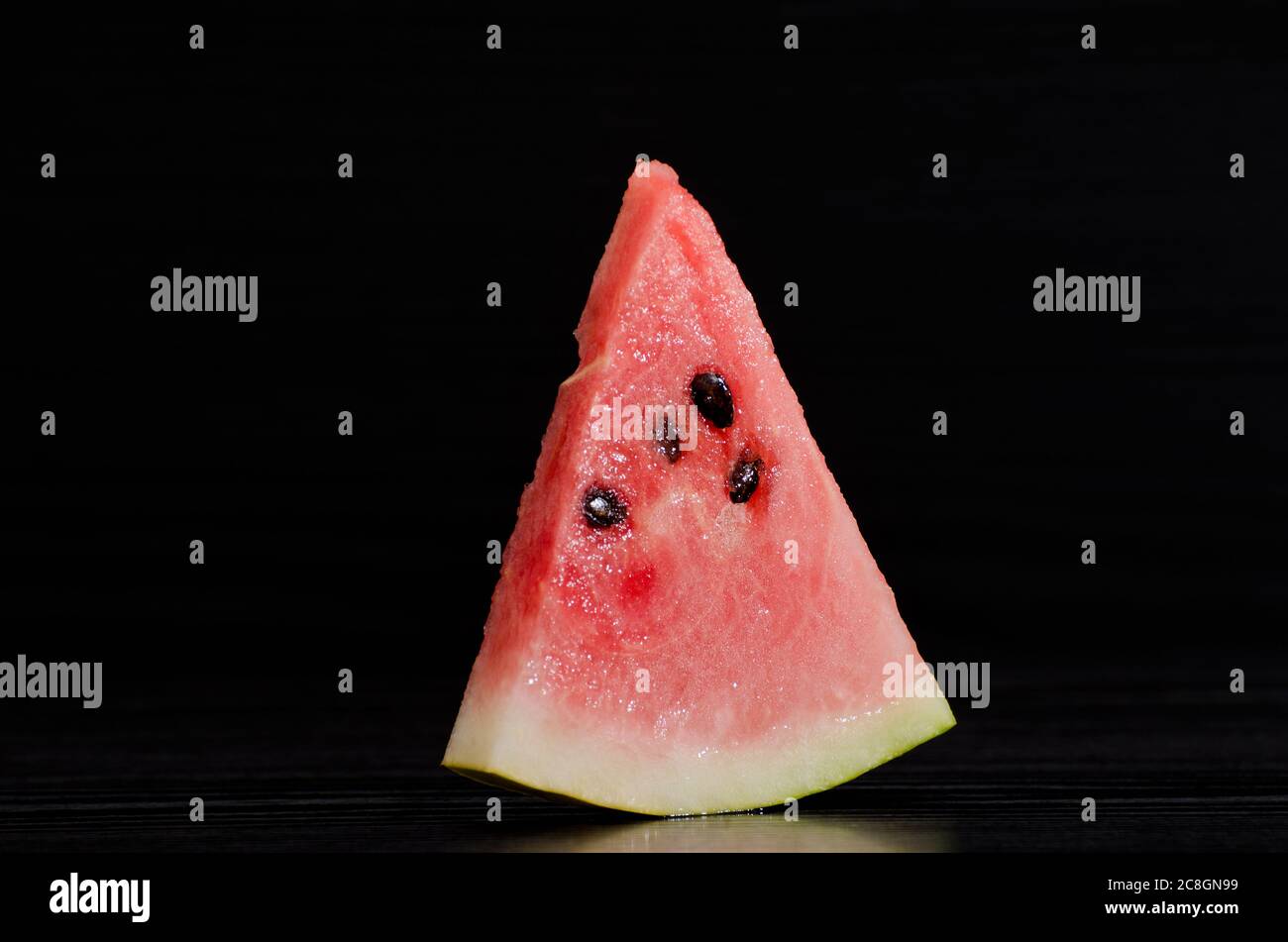 White Triangle Ripe Triangle ripe watermelon on a black background Stock Photo - Alamy