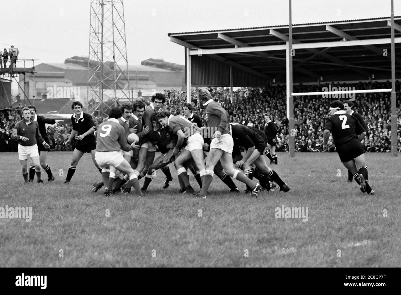 Llanelli RFCs David Pickering feeding the ball to scrum half Mark Douglas in their game against the touring New Zealand All Blacks at Stradey Park, Llanelli on 21 October 1980. Stock Photo