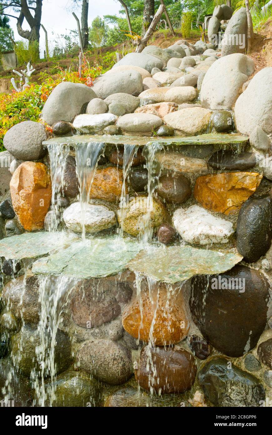 Artificial waterfall made with stones, outdoor installation, nonpotable water, manmade