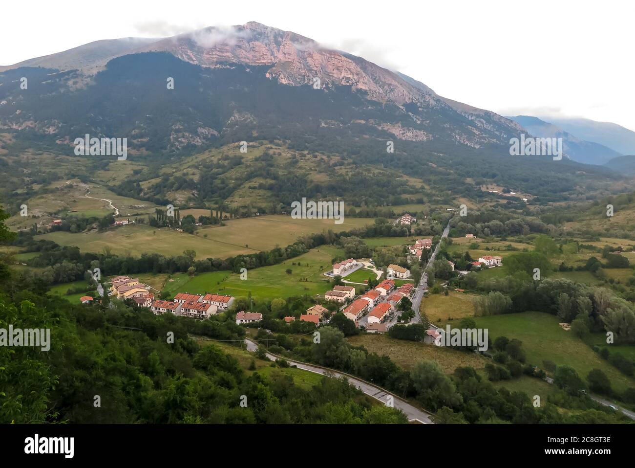 Small town among mountain valley Stock Photo - Alamy
