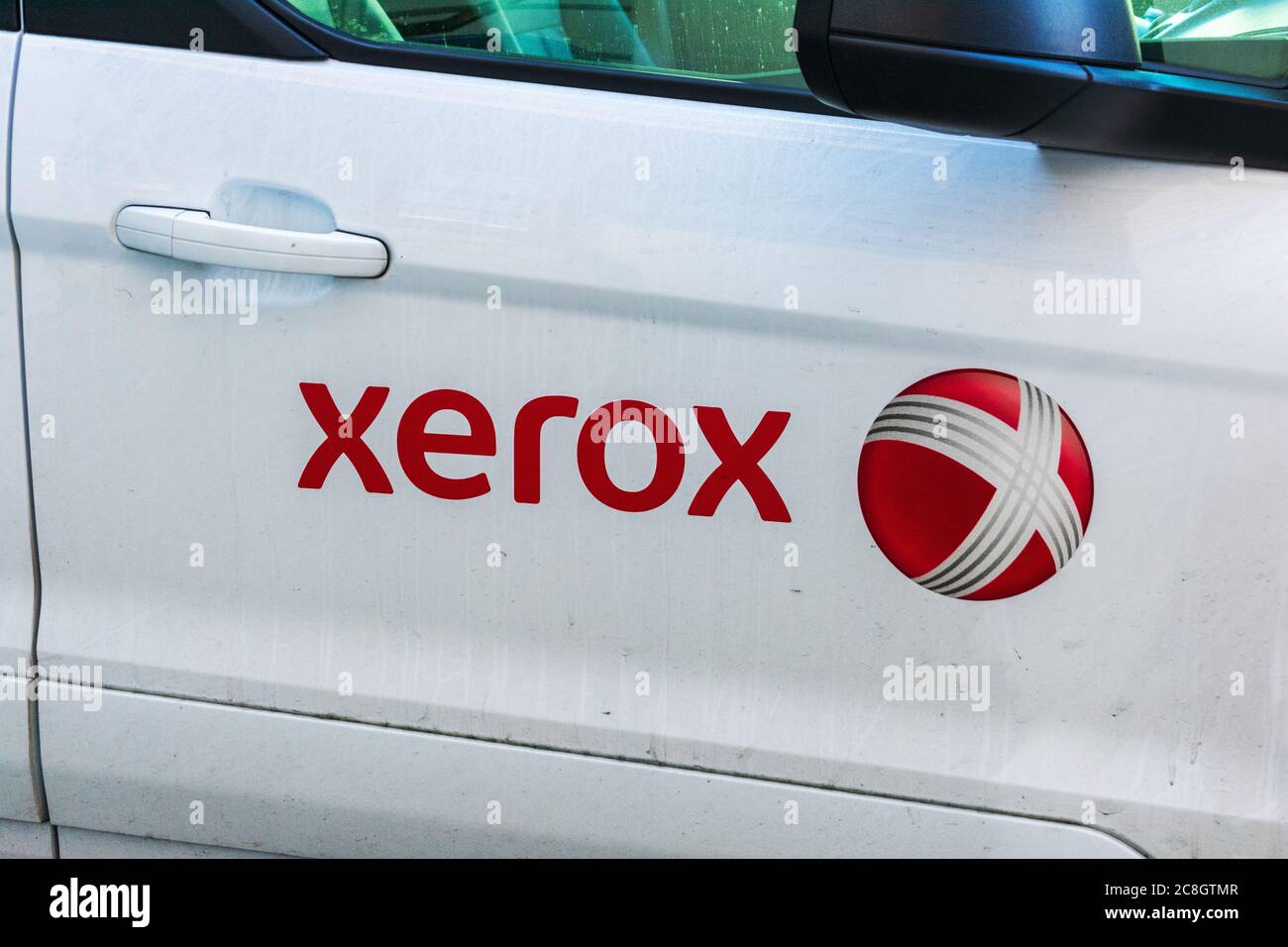 Xerox sign and logo on the door of service vehicle parked at client location - San Francisco, California, USA - 2020 Stock Photo