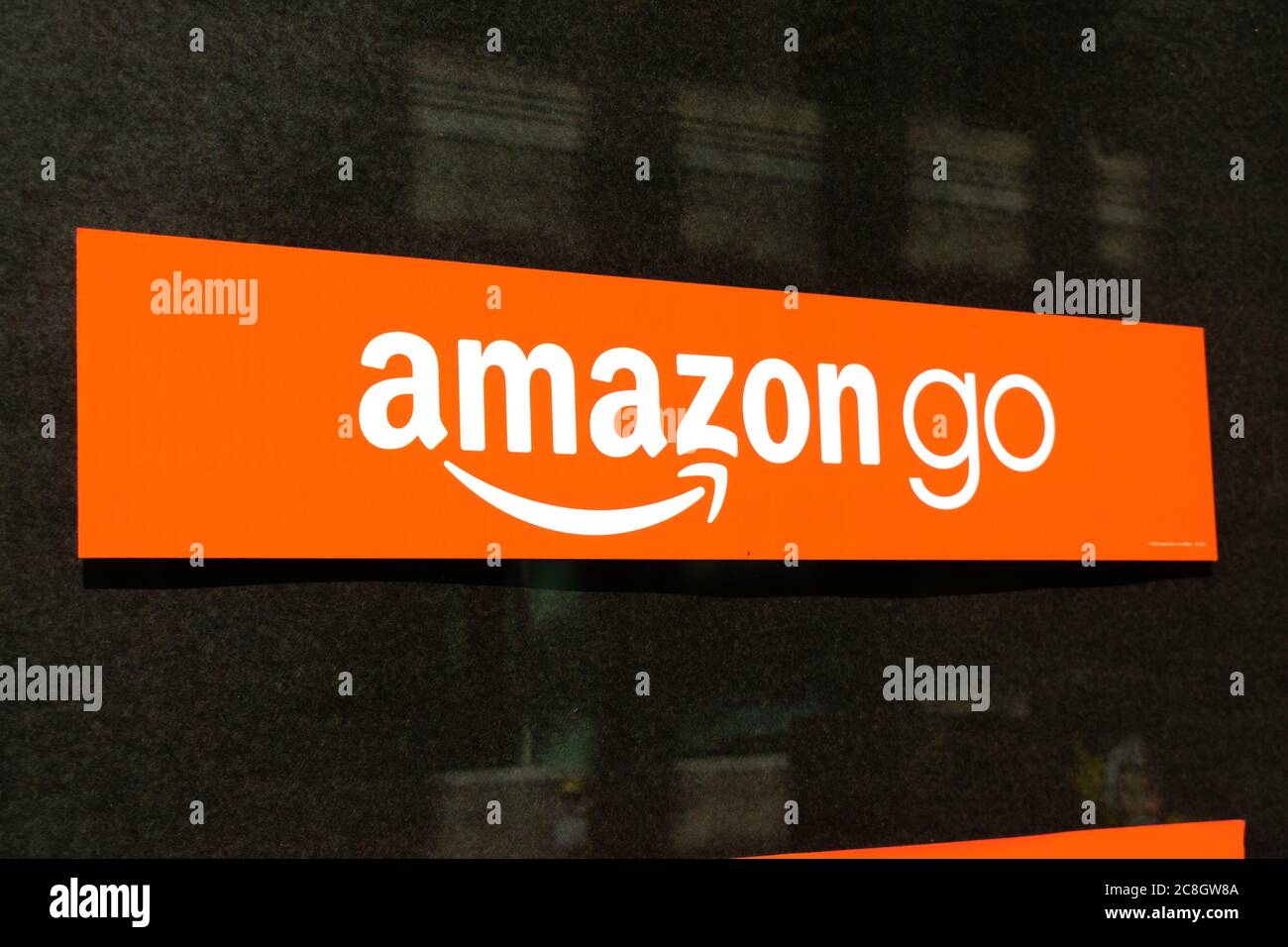 Amazon Go sign on store window. Amazon Go is a chain of cashless convenience stores with automated checkout, operated by Amazon - San Francisco, Calif Stock Photo
