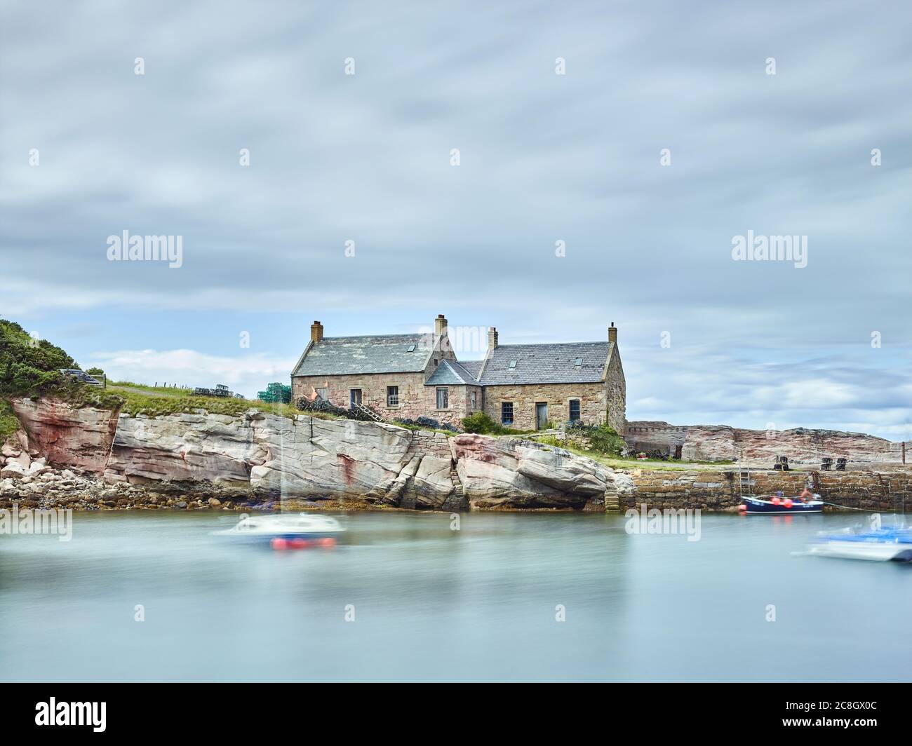 A Long Exposure photograph of Cove Harbour, Scottish Borders in the the